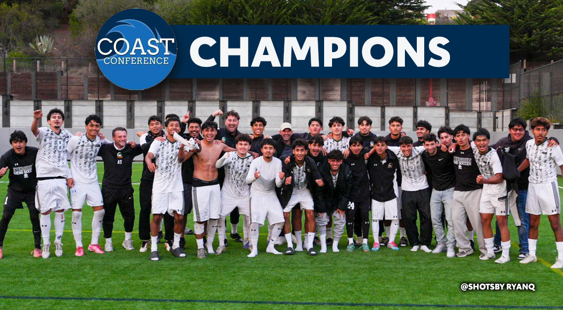 The team is celebrating in white jerseys and black jackets on the field. Coast Conference champions